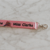 Personalised lanyards with safety break away clip and a lobster claw.Pink lanyard with pencil design - close up of lobster clip